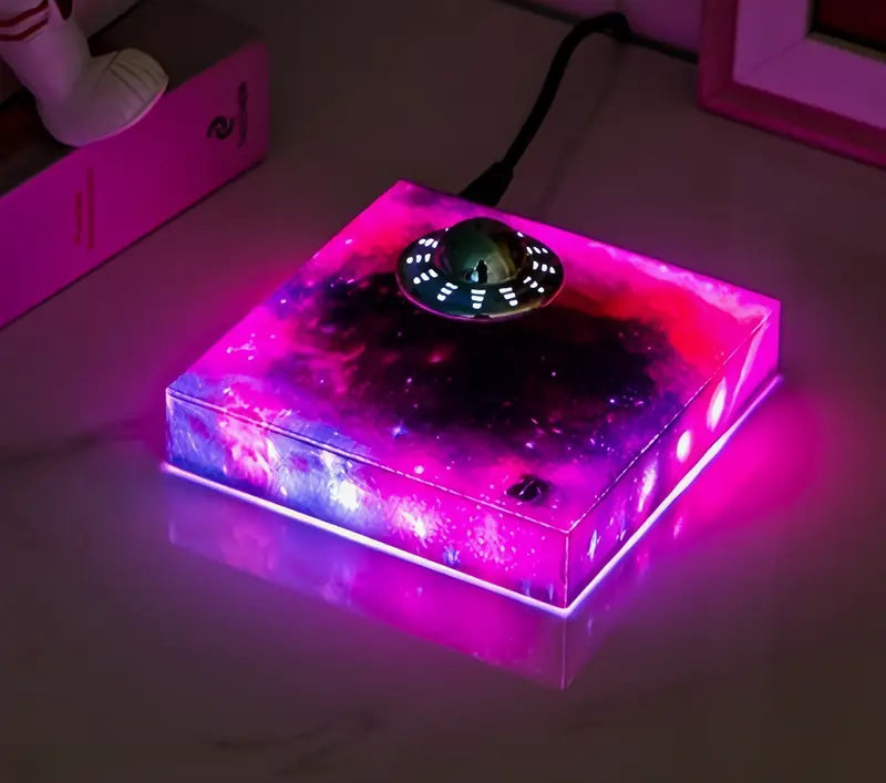 The galaxy base glowing pink with the UFO on top